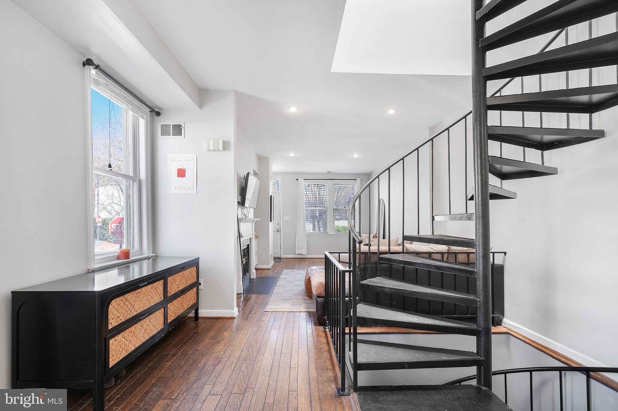 3256 Q Street Northwest Washington, DC 20007 - Photo 8 of 20 a view of entryway with wooden floor and stairs