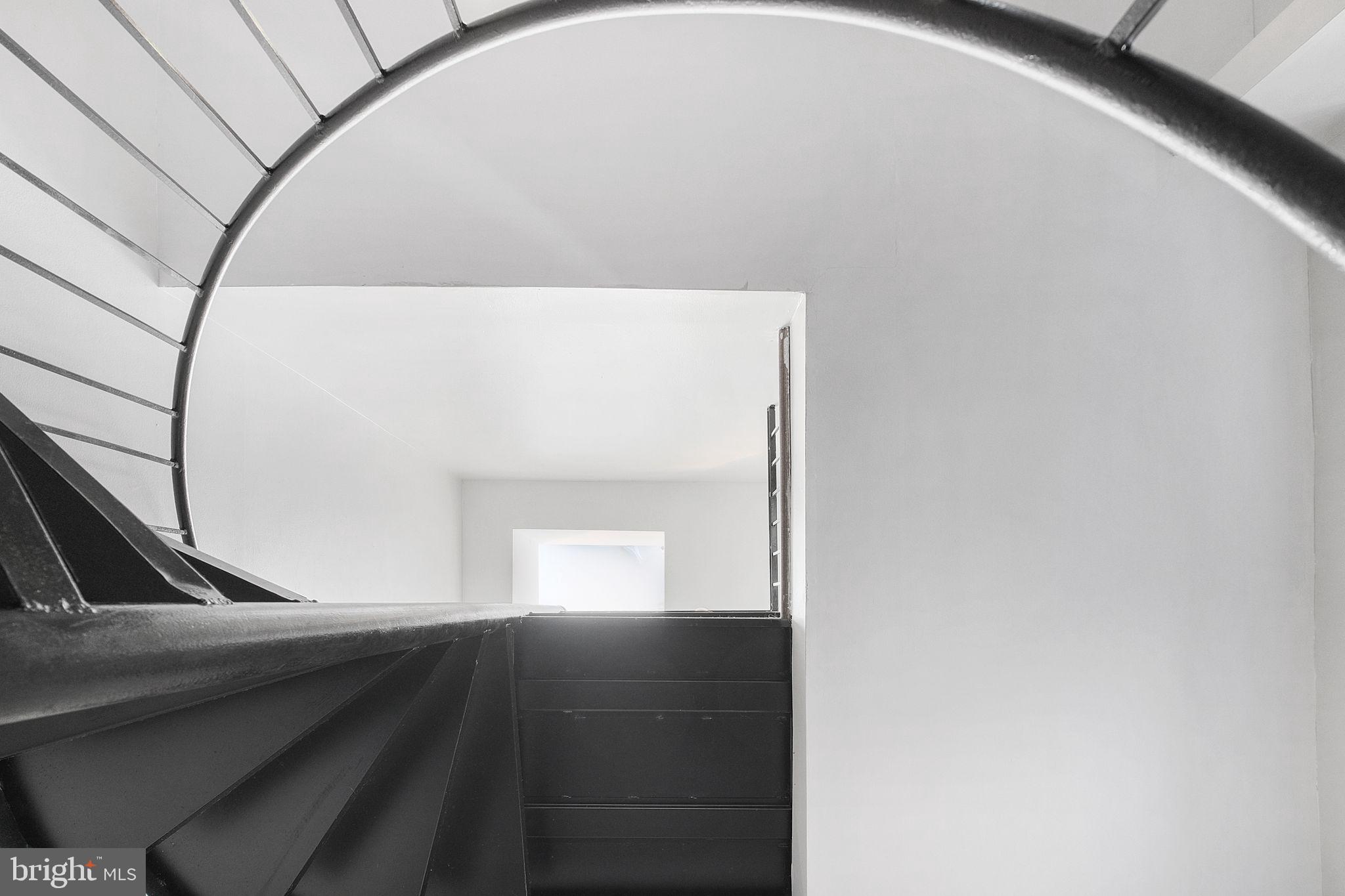 3256 Q Street Northwest Washington, DC 20007 - Photo 10 of 20 a view of an empty room with wooden floor