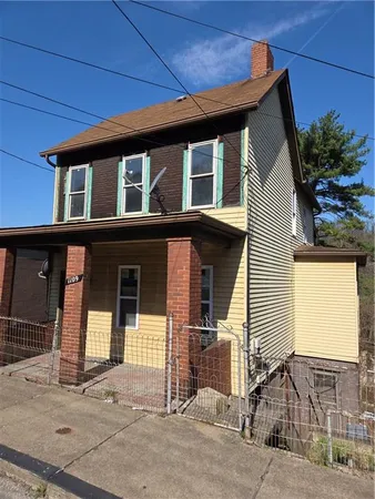 a front view of a house with a garage