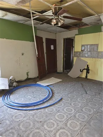 a room with a pool and a chandelier