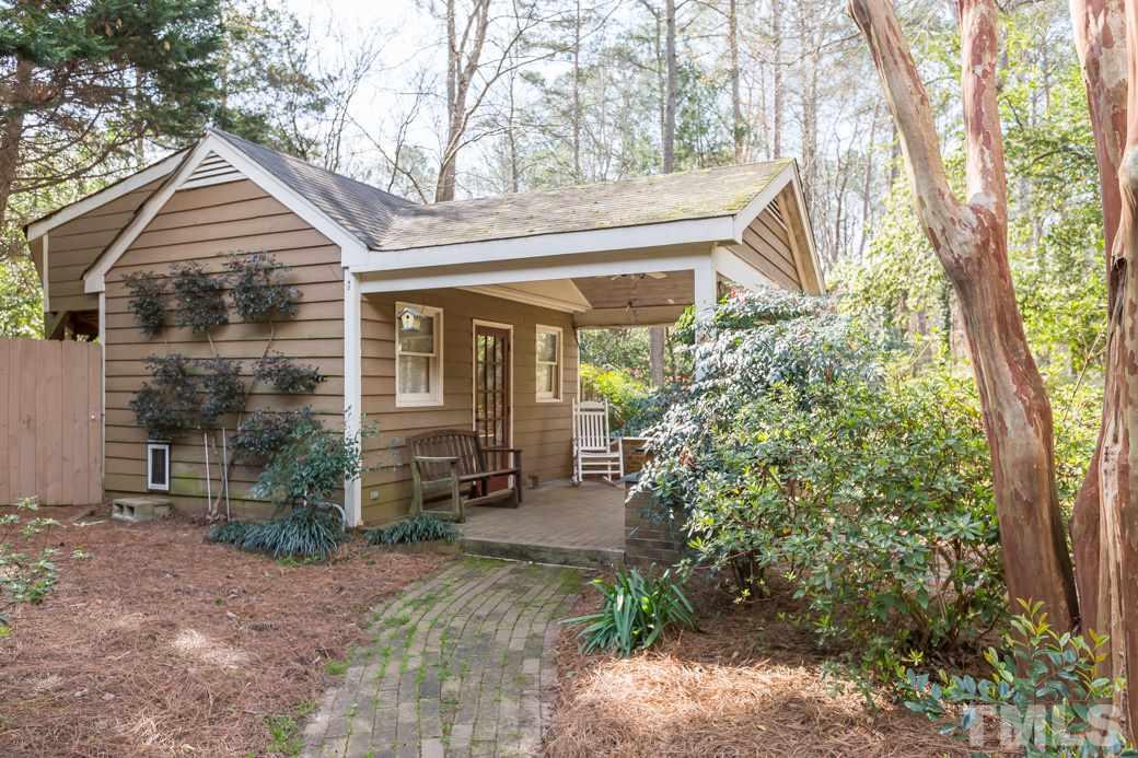 8632 Langtree Lane Raleigh, NC 27613 - Photo 2 of 25 a front view of a house with garden