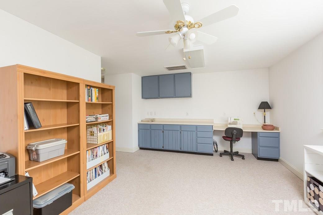 8632 Langtree Lane Raleigh, NC 27613 - Photo 14 of 25 a room with furniture and a dresser