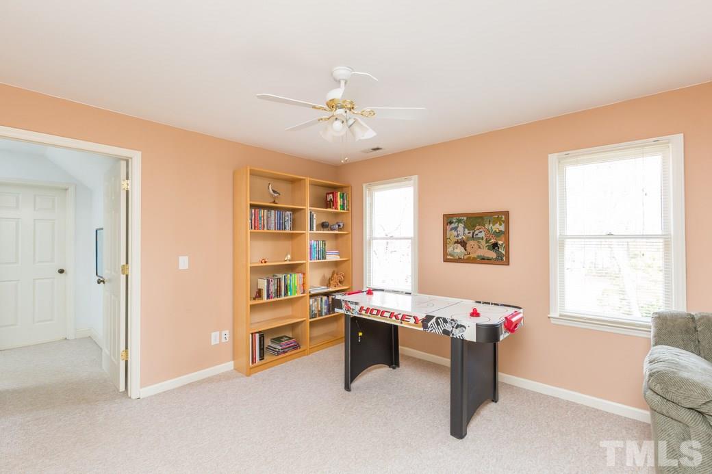 8632 Langtree Lane Raleigh, NC 27613 - Photo 15 of 25 a room with furniture and window