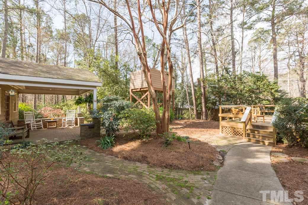 8632 Langtree Lane Raleigh, NC 27613 - Photo 19 of 25 a view of a outdoor space with a patio and backyard