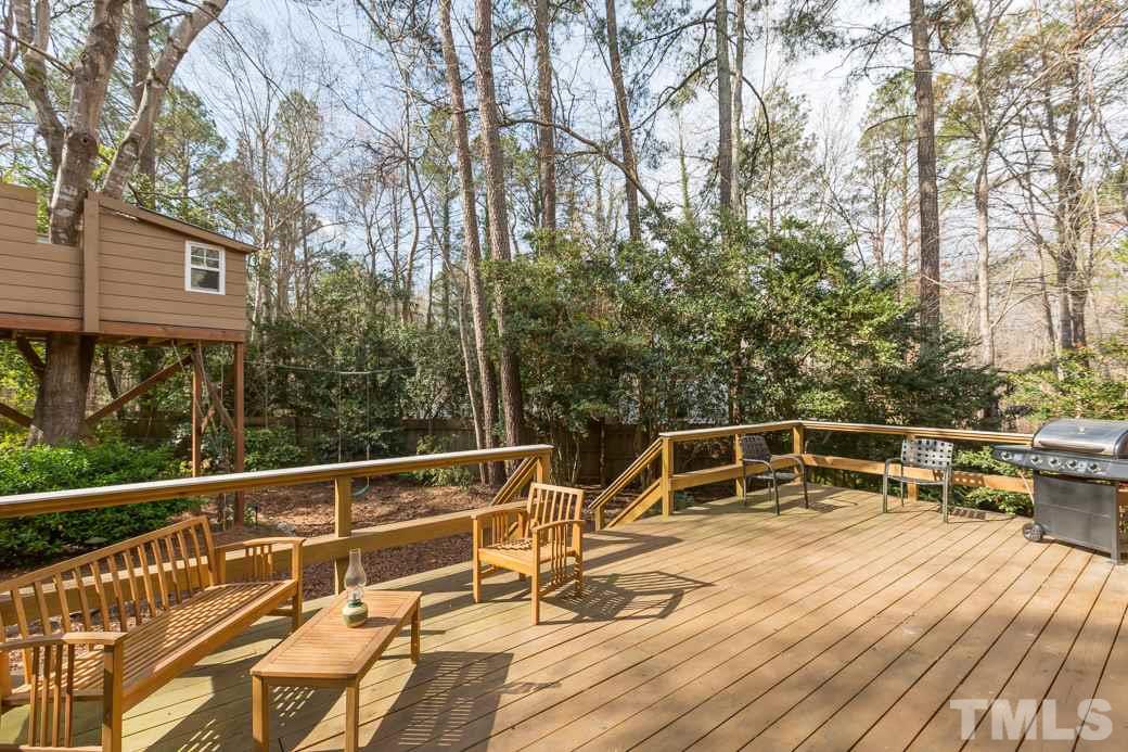 8632 Langtree Lane Raleigh, NC 27613 - Photo 20 of 25 a view of a roof deck with lawn chairs and wooden floor