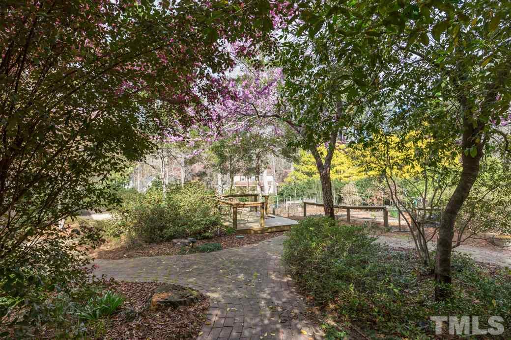 8632 Langtree Lane Raleigh, NC 27613 - Photo 22 of 25 a view of a park with large trees