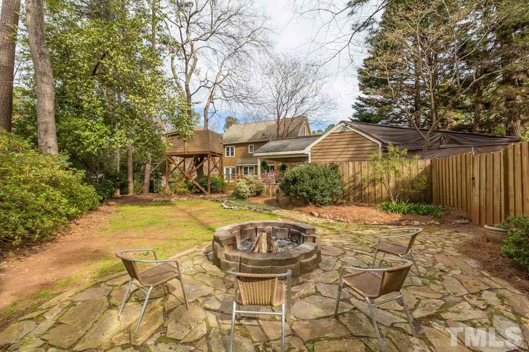 8632 Langtree Lane Raleigh, NC 27613 - Photo 23 of 25 a view of a swimming pool with a patio and a yard