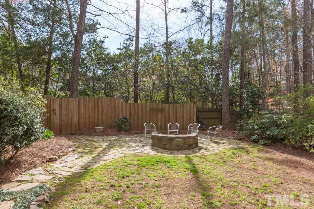 8632 Langtree Lane Raleigh, NC 27613 - Photo 24 of 25 a backyard of house with a table and chairs