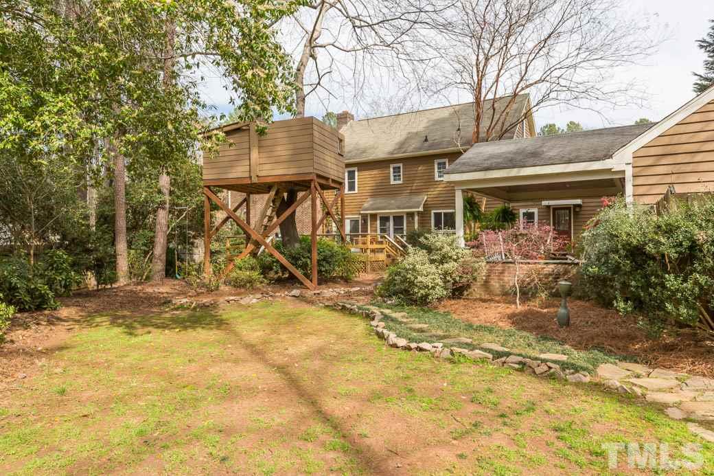 8632 Langtree Lane Raleigh, NC 27613 - Photo 25 of 25 front view of a house with a yard