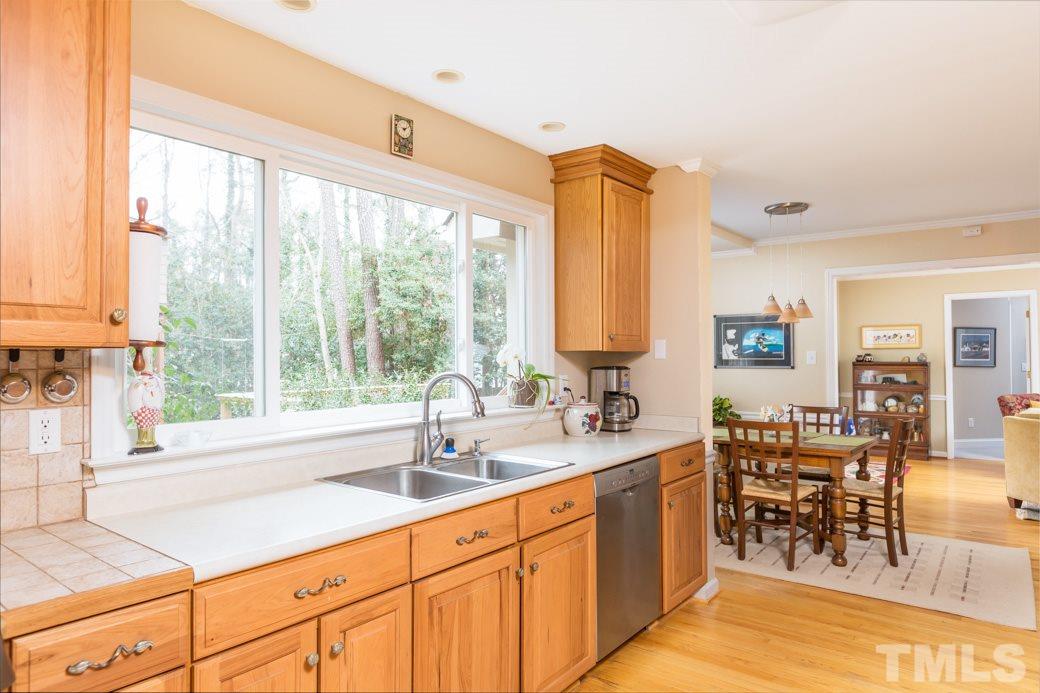 8632 Langtree Lane Raleigh, NC 27613 - Photo 7 of 25 a kitchen with counter top space and sink