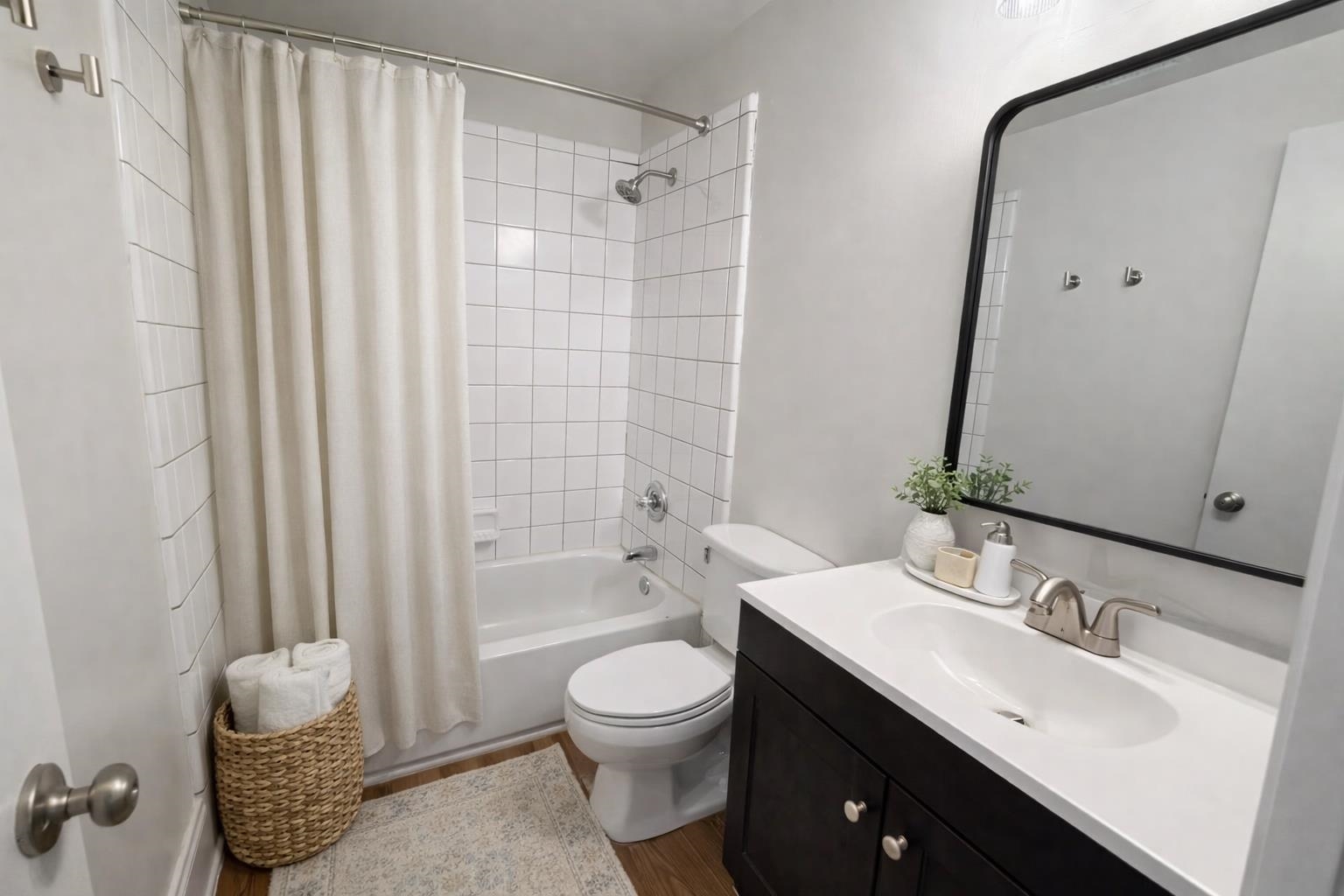 129 Talbot Avenue, Unit 103 Memphis, TN 38103 - Photo 5 of 5 Bathroom with vanity, shower / tub combo, and dark wood-type flooring