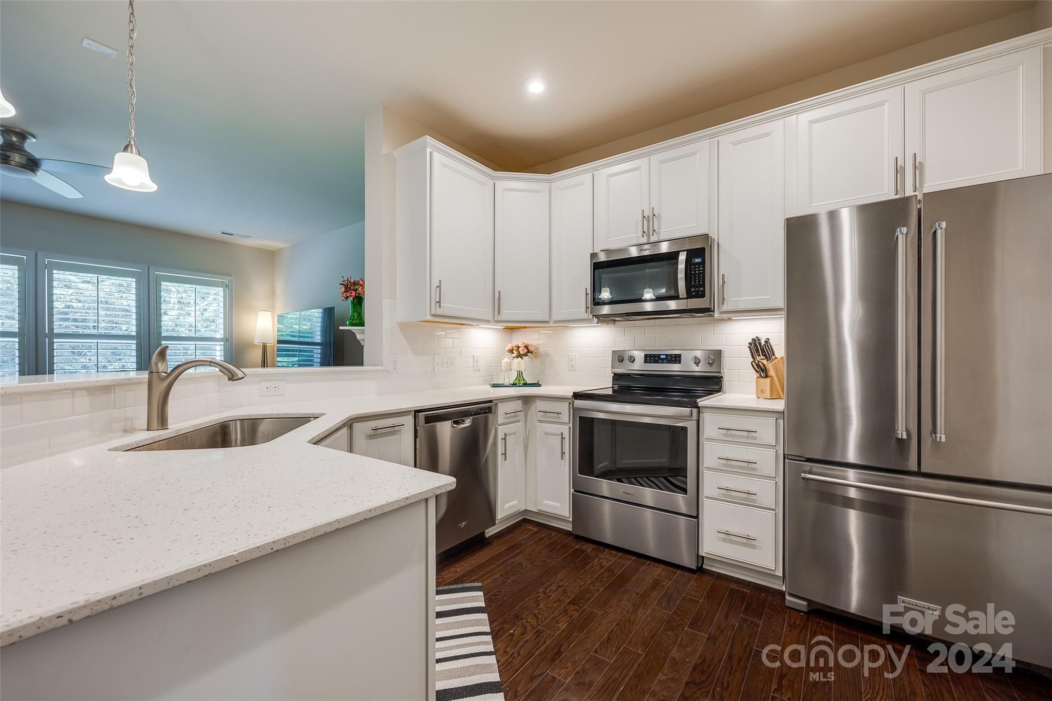 505 Hunters Dance Road Fort Mill, SC 29708 - Photo 6 of 34 a kitchen with stainless steel appliances a refrigerator stove microwave and sink