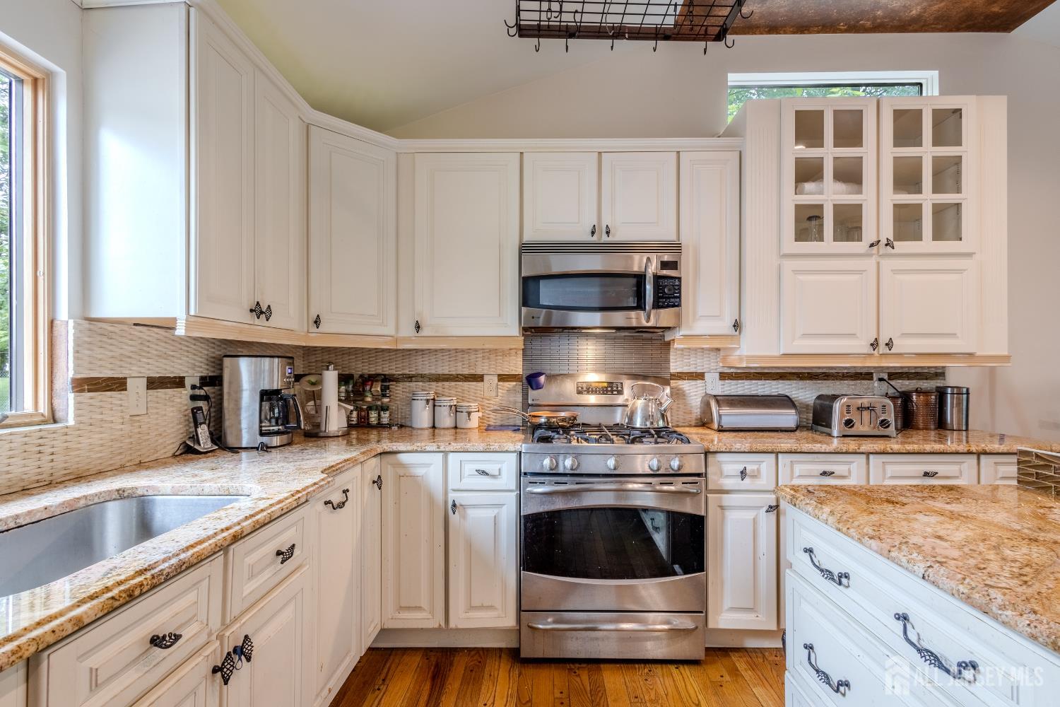 170 Jordan Road Colonia, NJ 07067 - Photo 12 of 36 a kitchen with stainless steel appliances granite countertop a stove a sink and a white cabinets