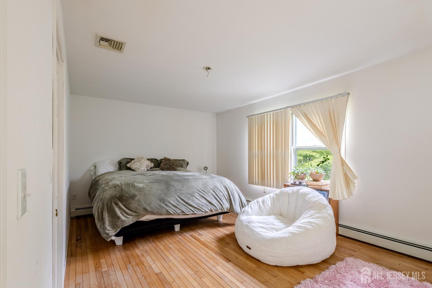 170 Jordan Road Colonia, NJ 07067 - Photo 26 of 36 a bedroom with a bed and a large window