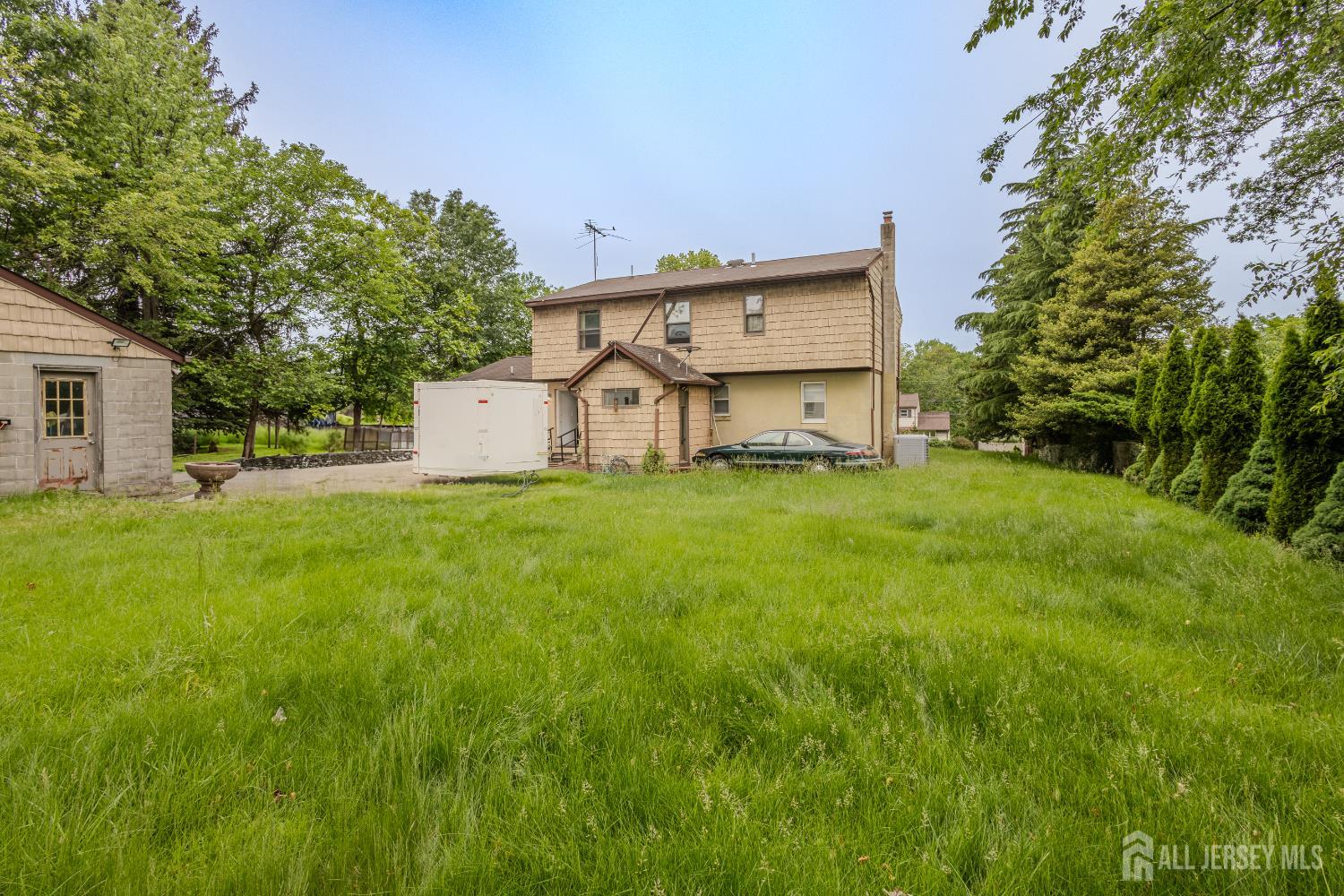 170 Jordan Road Colonia, NJ 07067 - Photo 36 of 36 a view of a house with a yard and a garage