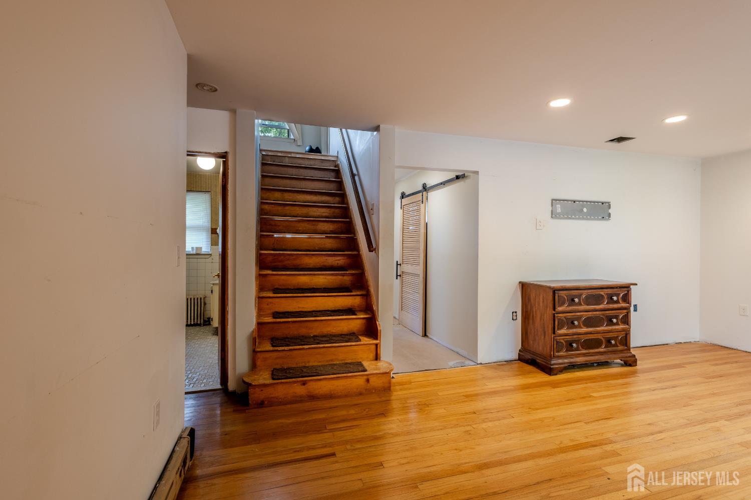 170 Jordan Road Colonia, NJ 07067 - Photo 7 of 36 a view of an empty room with stairs and ventilation