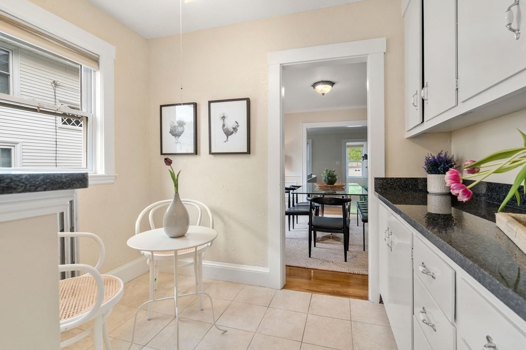 23 Fuller Road, Unit 23 Watertown, MA 02472 - Photo 11 of 31 a kitchen with a sink cabinets and dining table