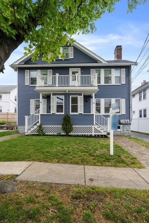 23 Fuller Road, Unit 23 Watertown, MA 02472 - Photo 4 of 31 a front view of a house with a yard