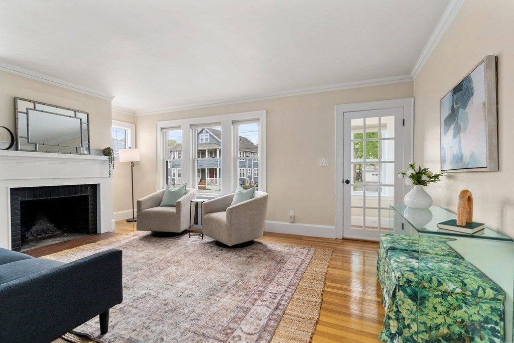 23 Fuller Road, Unit 23 Watertown, MA 02472 - Photo 8 of 31 a living room with furniture and a fireplace