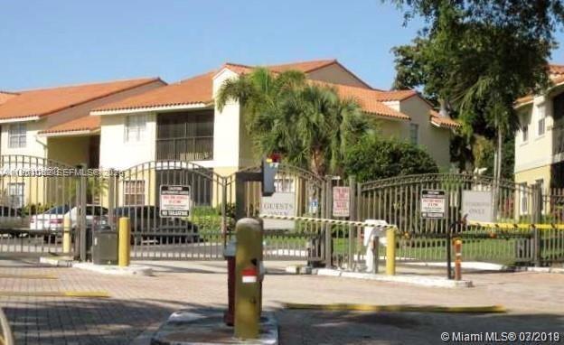 1235 Southwest 46th Avenue, Unit 711 Pompano Beach, FL 33069 - Photo 20 of 43 a front view of a building with street view