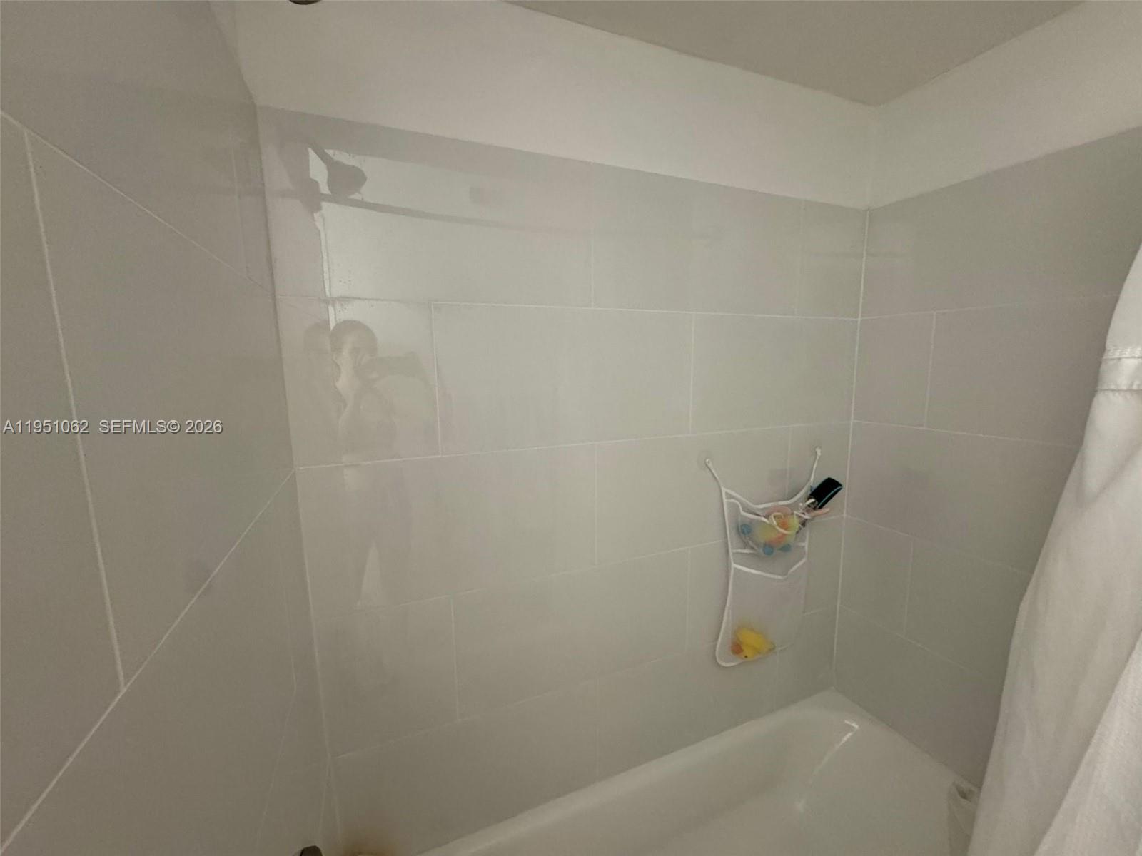1235 Southwest 46th Avenue, Unit 711 Pompano Beach, FL 33069 - Photo 39 of 43 a bathroom with a bathtub