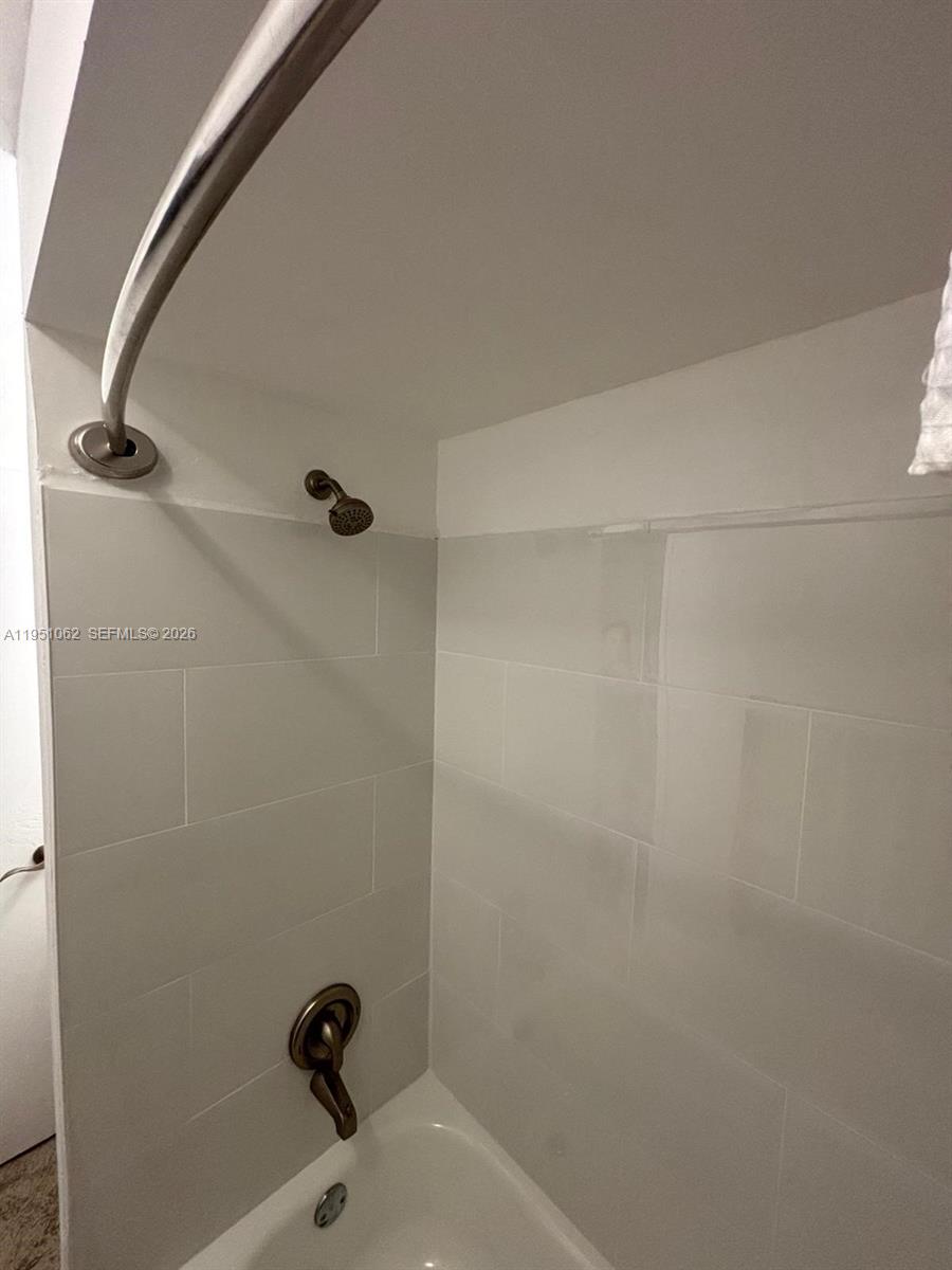 1235 Southwest 46th Avenue, Unit 711 Pompano Beach, FL 33069 - Photo 41 of 43 a bathroom with a sink