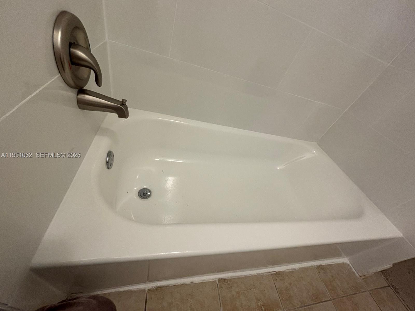 1235 Southwest 46th Avenue, Unit 711 Pompano Beach, FL 33069 - Photo 43 of 43 a bathroom with a sink