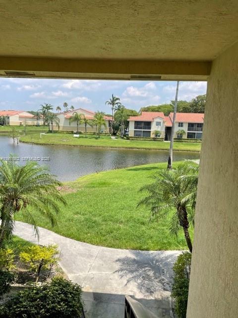 1235 Southwest 46th Avenue, Unit 711 Pompano Beach, FL 33069 - Photo 9 of 43 a view of a garden with an ocean