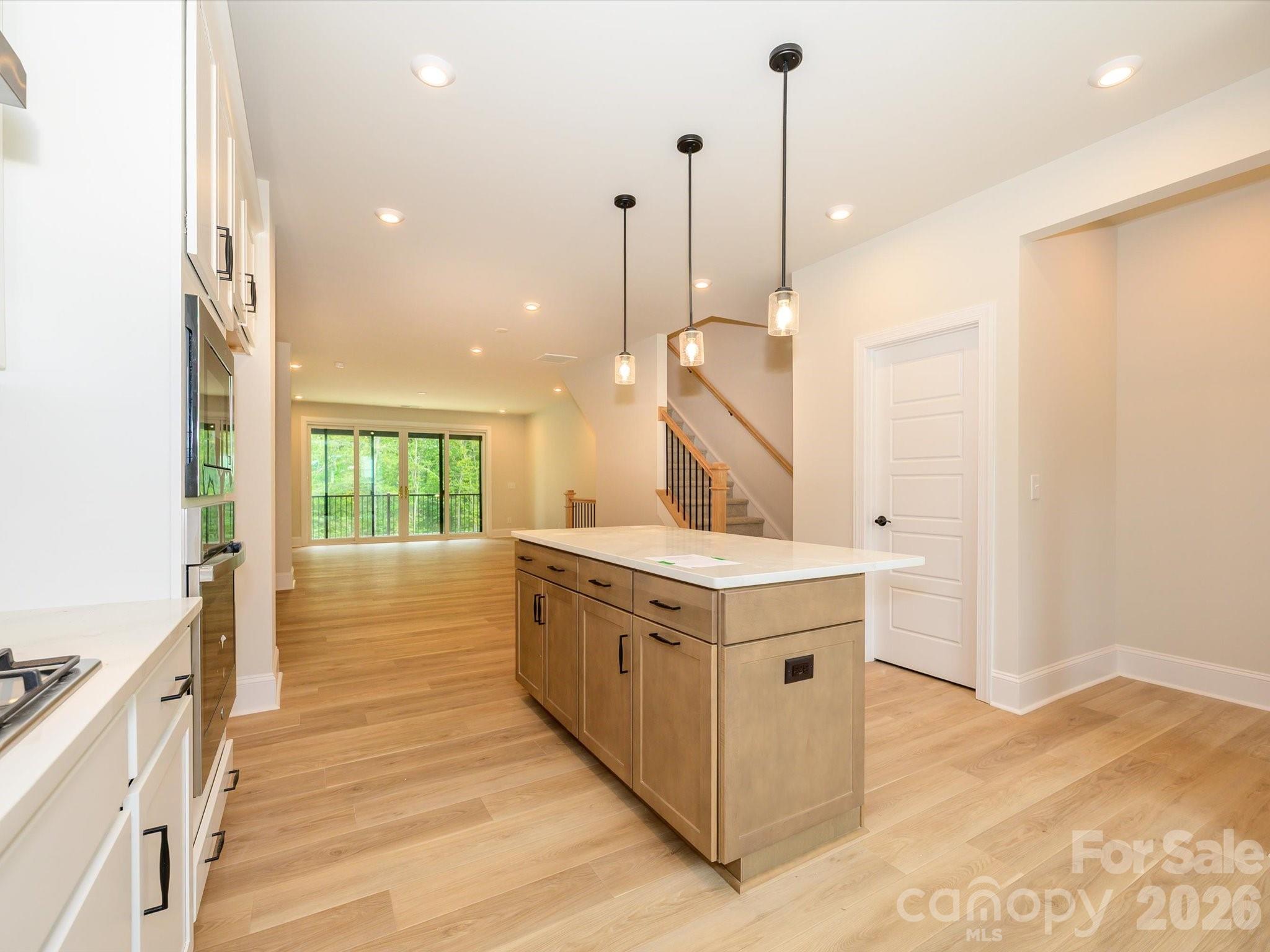 412 Old Town Vlg Road Waxhaw, NC 28173 - Photo 16 of 29 a kitchen with a stove and a wooden floor