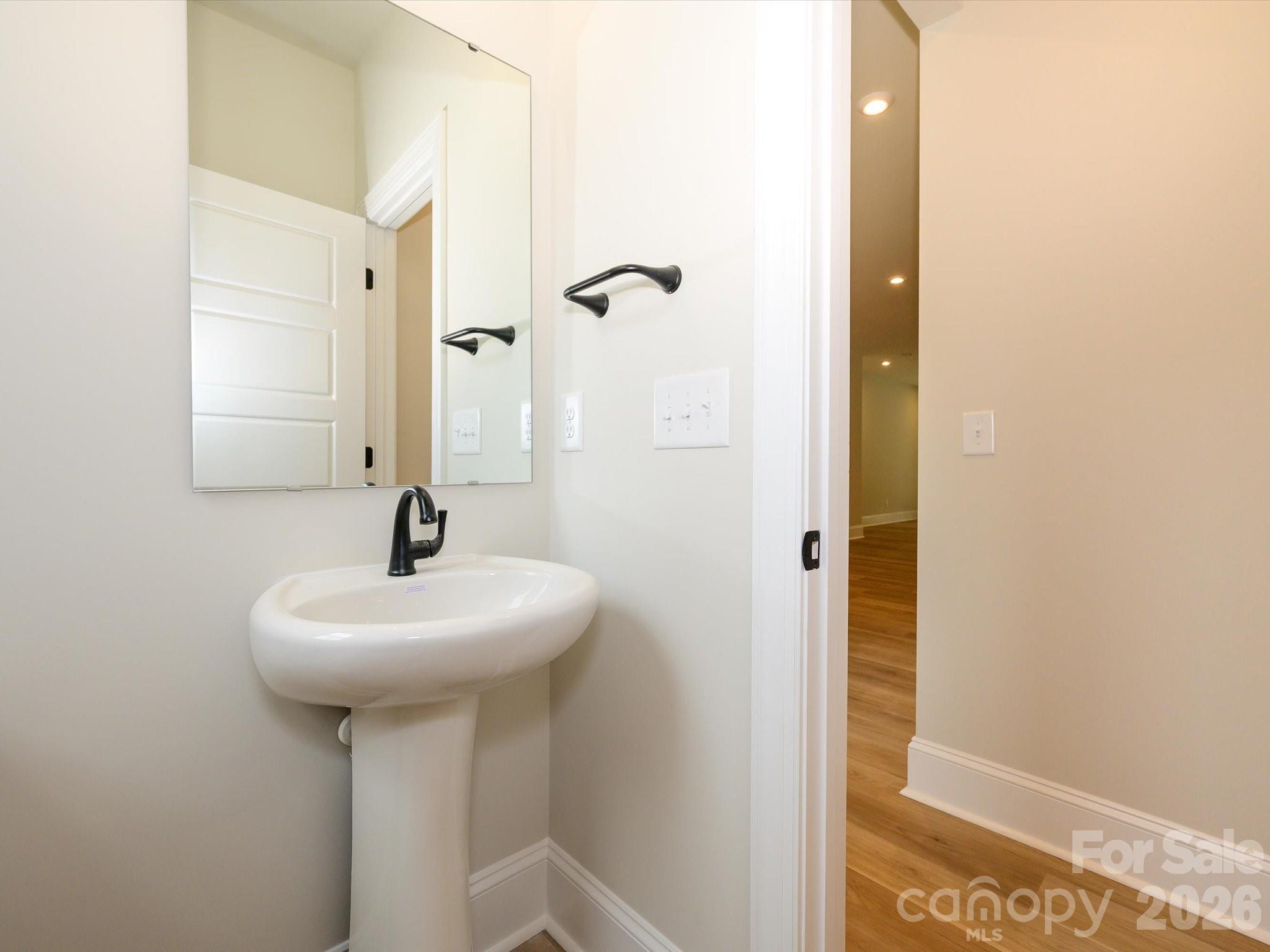 412 Old Town Vlg Road Waxhaw, NC 28173 - Photo 18 of 29 a bathroom with a sink and a mirror