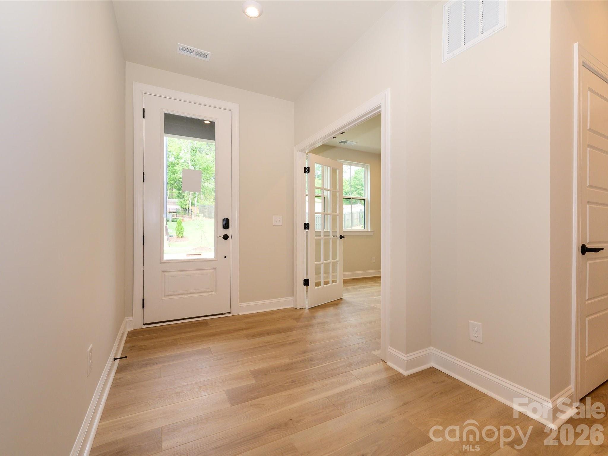 412 Old Town Vlg Road Waxhaw, NC 28173 - Photo 3 of 29 an empty room with mirror and a window