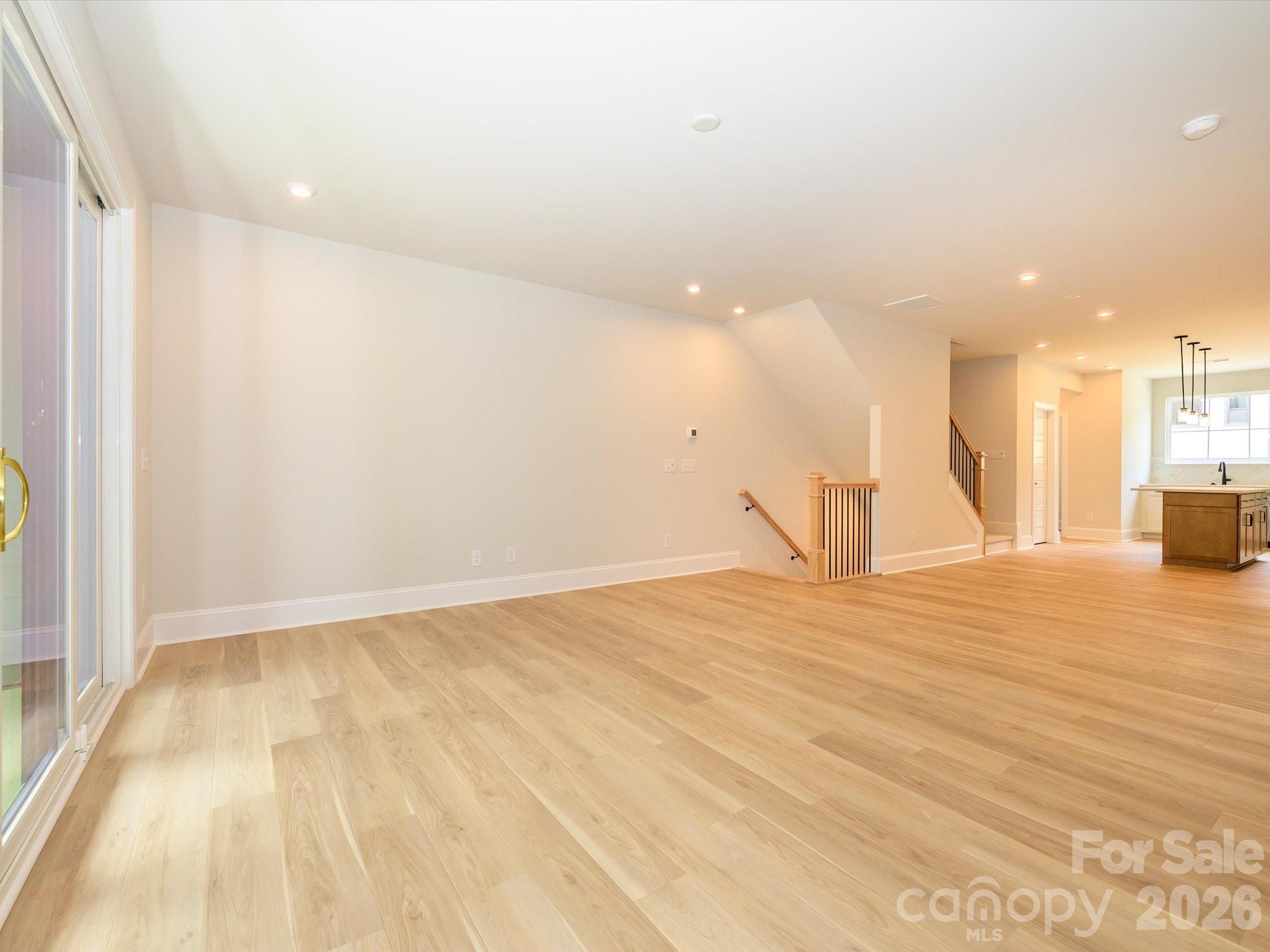412 Old Town Vlg Road Waxhaw, NC 28173 - Photo 10 of 29 a view of empty room with wooden floor