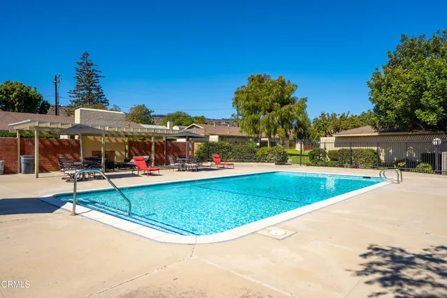 a view of a swimming pool with a lounge chairs