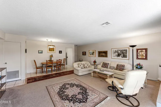 a living room with furniture and a table