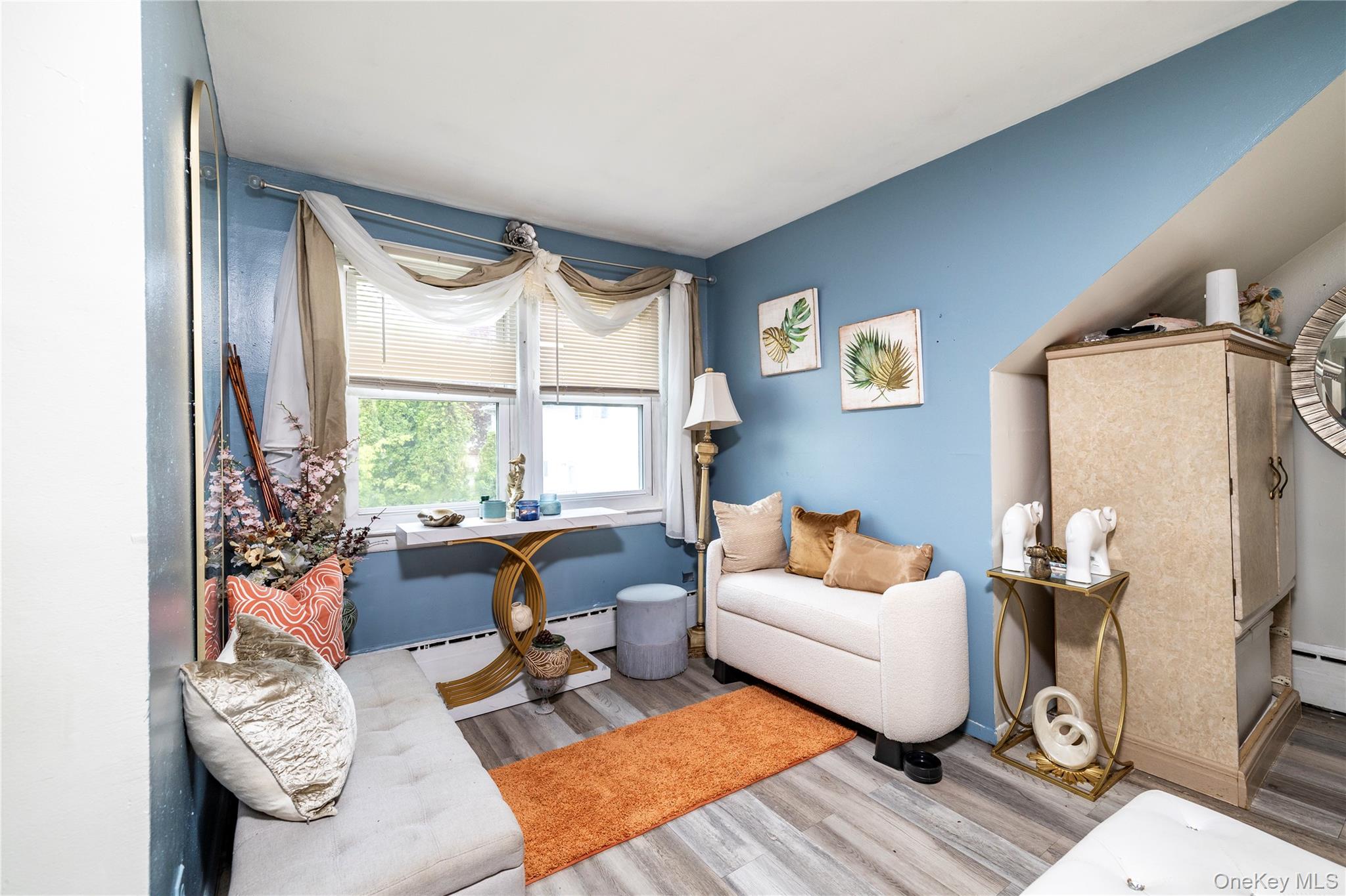 265 Beachview Street Copiague, NY 11726 - Photo 12 of 19 a living room with furniture and a window