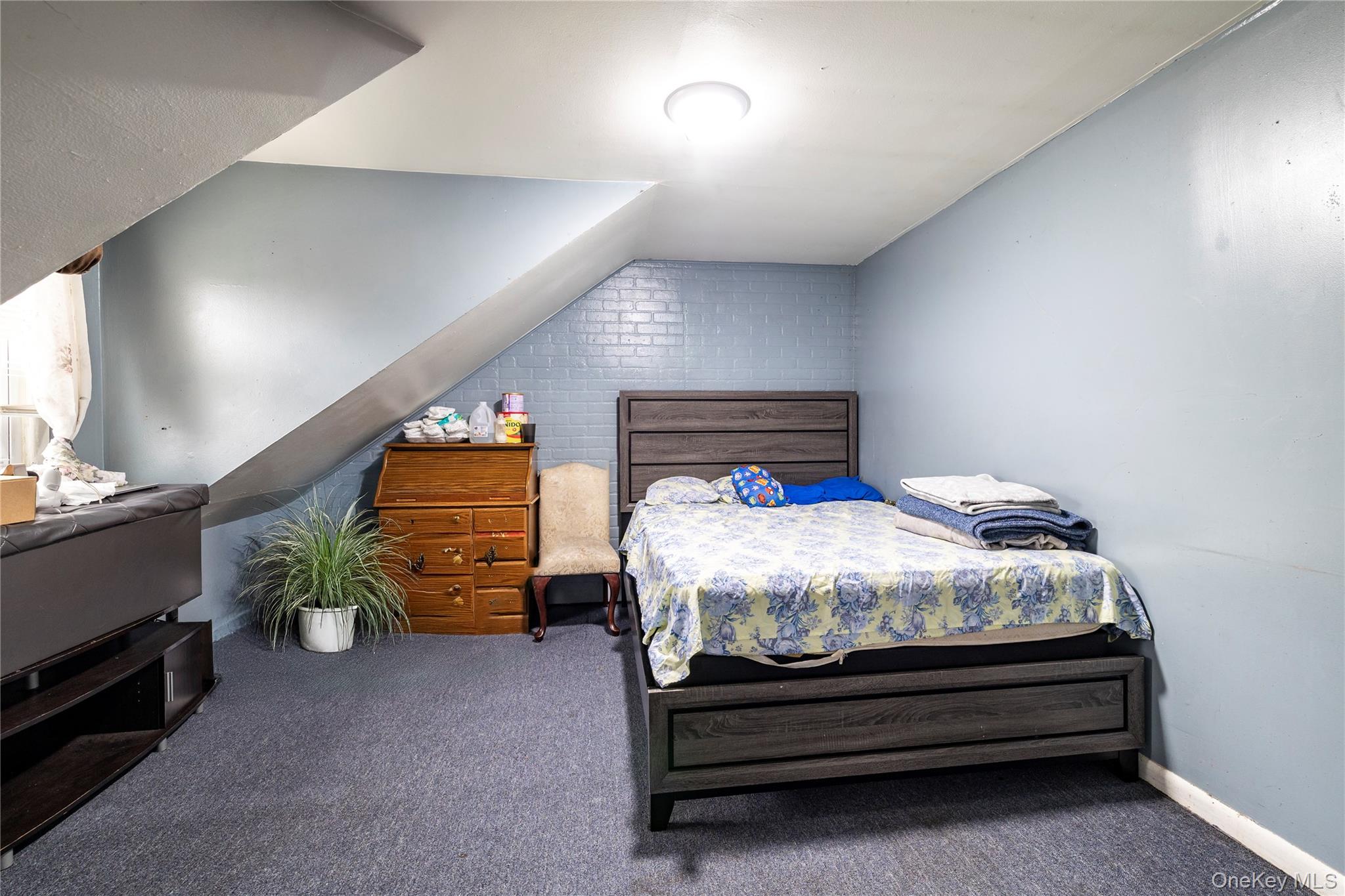 265 Beachview Street Copiague, NY 11726 - Photo 13 of 19 a bedroom with a bed and a closet