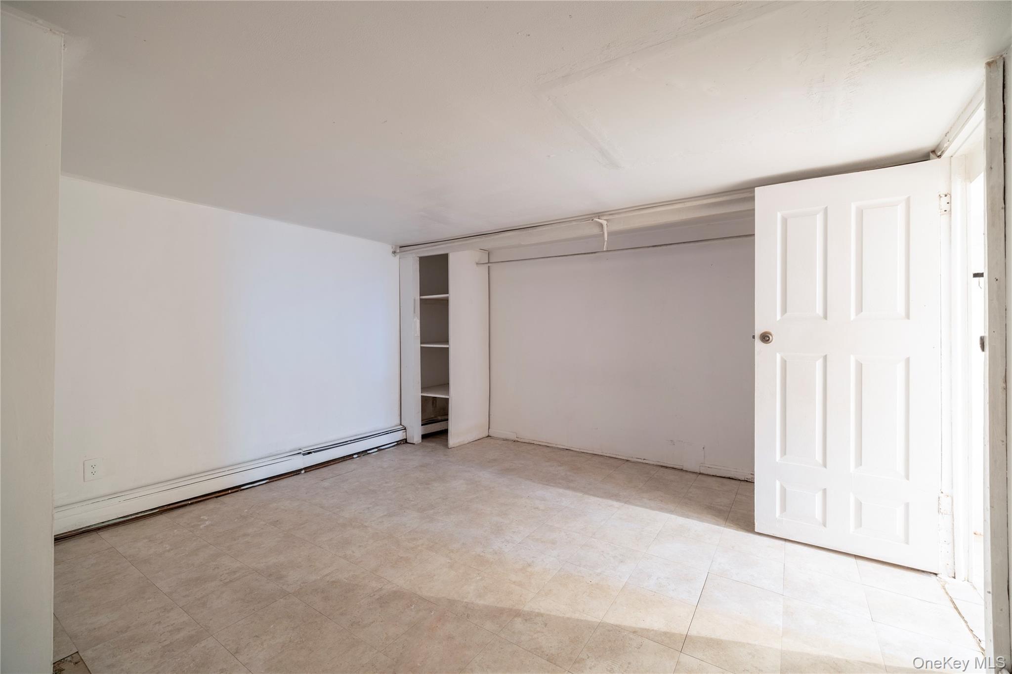 265 Beachview Street Copiague, NY 11726 - Photo 14 of 19 an empty room with a empty space