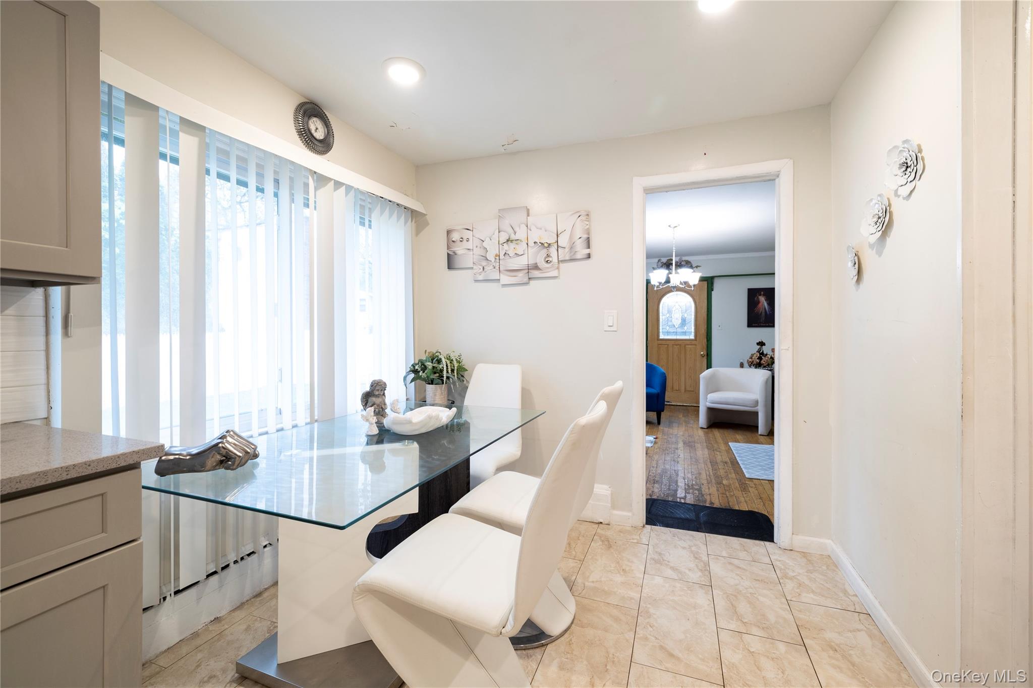 265 Beachview Street Copiague, NY 11726 - Photo 18 of 19 a view of a dining room with furniture and a window