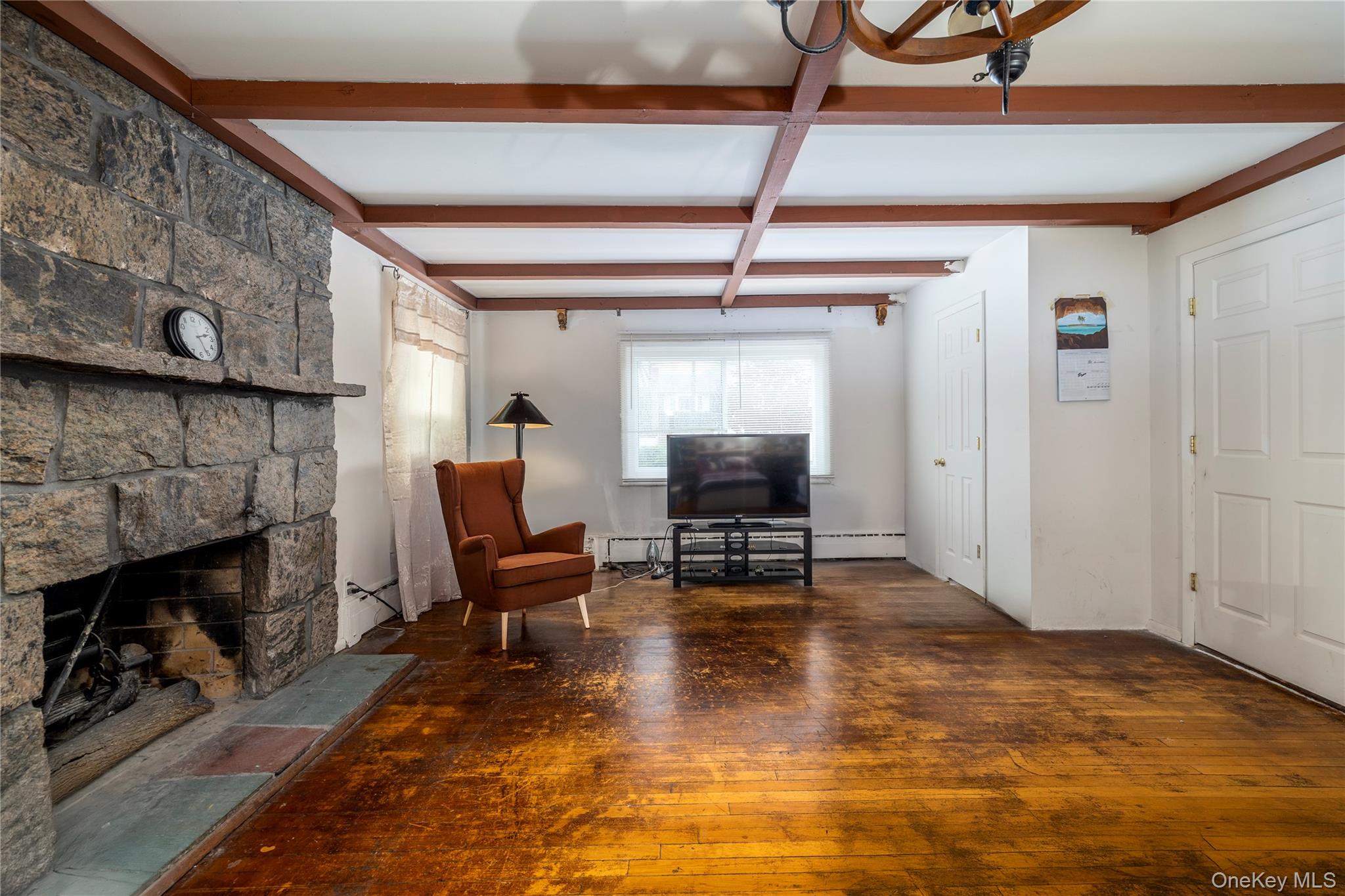 265 Beachview Street Copiague, NY 11726 - Photo 9 of 19 a living room with furniture and a fireplace