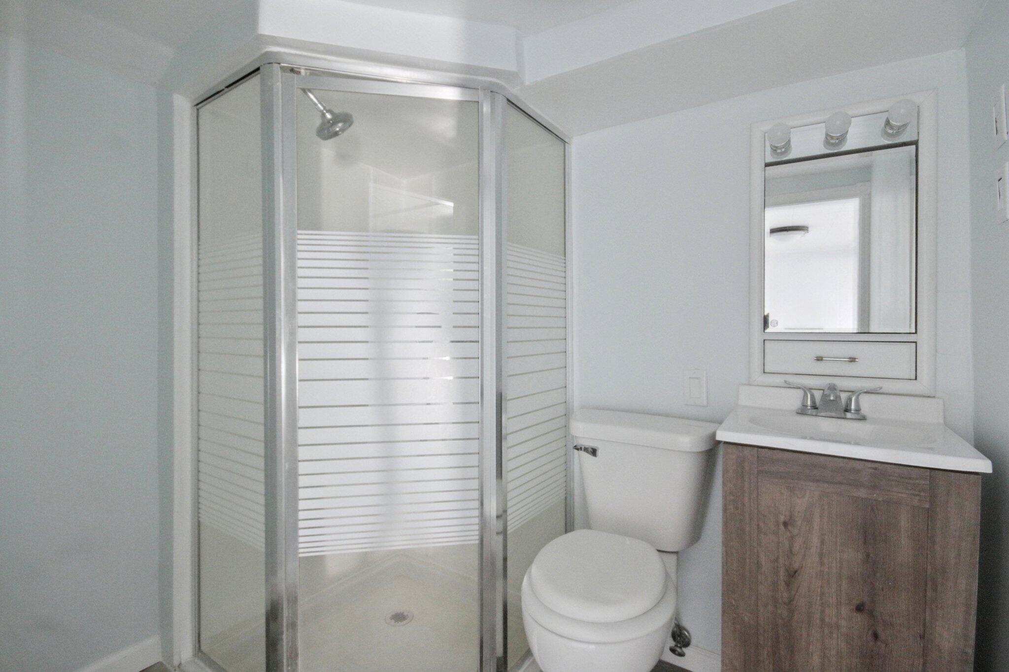 2355 McCool Road Portage, IN 46368 - Photo 17 of 19 a bathroom with a sink a toilet and shower