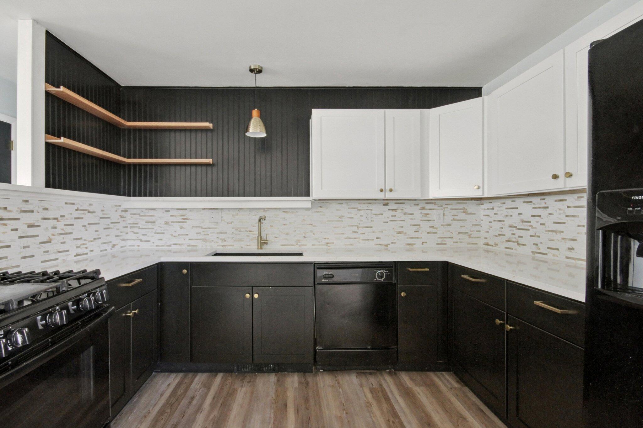 2355 McCool Road Portage, IN 46368 - Photo 6 of 19 a kitchen with a sink and cabinets
