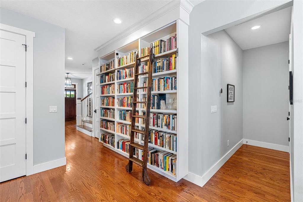 2501 Winter Park Road Winter Park, FL 32789 - Photo 12 of 63 a view of room with wooden floor and book shelf