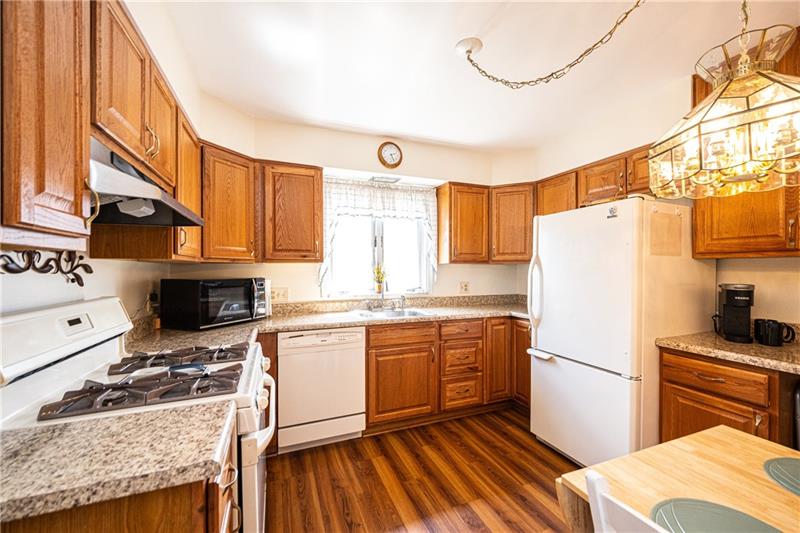 625 Main Street McKees Rocks, PA 15136 - Photo 5 of 25 UPDATED EAT-IN KITCHEN WITH FULL COMPLIMENT OF APPLIANCES AND LAMINATE FLOORING