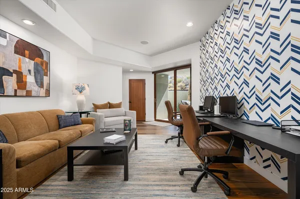 a bedroom with a bed and a television