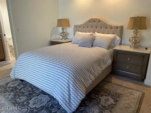 a bathroom with a granite countertop sink mirror and shower