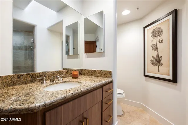 an outdoor space with furniture and umbrella