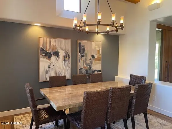 a large kitchen with a table and chairs