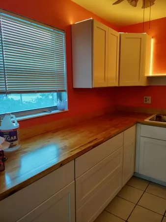 a kitchen with a sink and cabinets