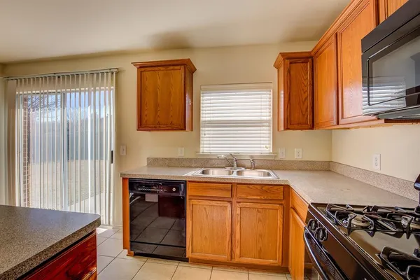 a kitchen with a stove and a sink