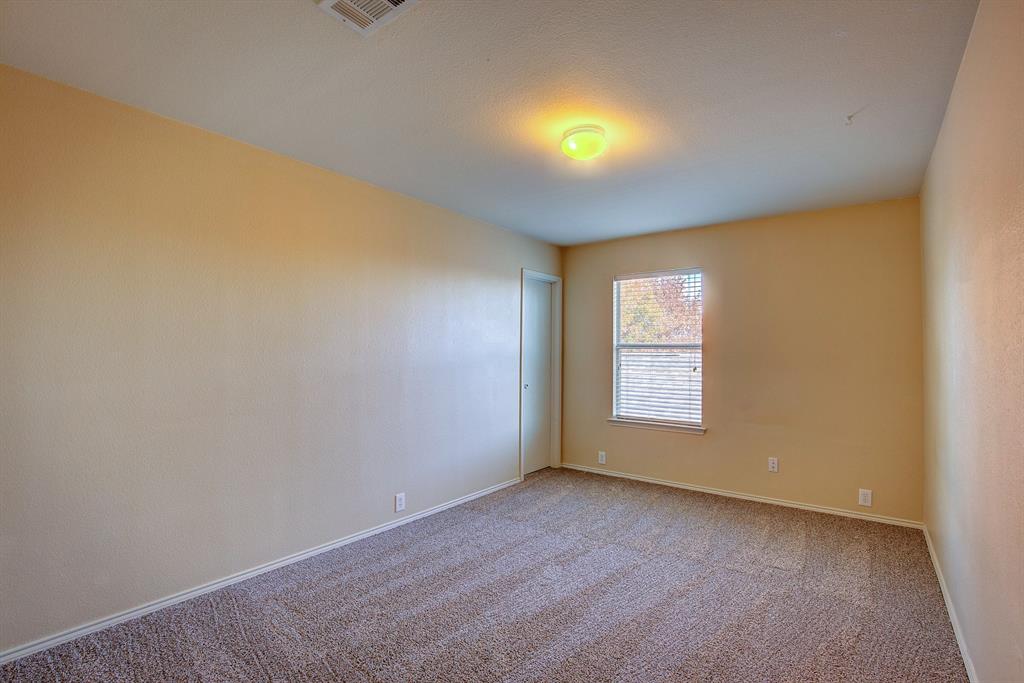 1720 Desperado Road Fort Worth, TX 76131 - Photo 30 of 40 a view of an empty room with a window and fire place